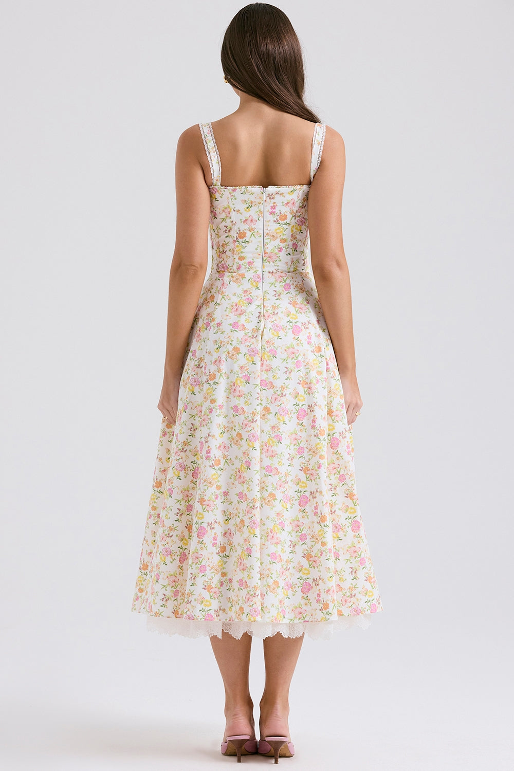 Back view of floral midi dress with wide straps and lace hem, women's wedding guest dress