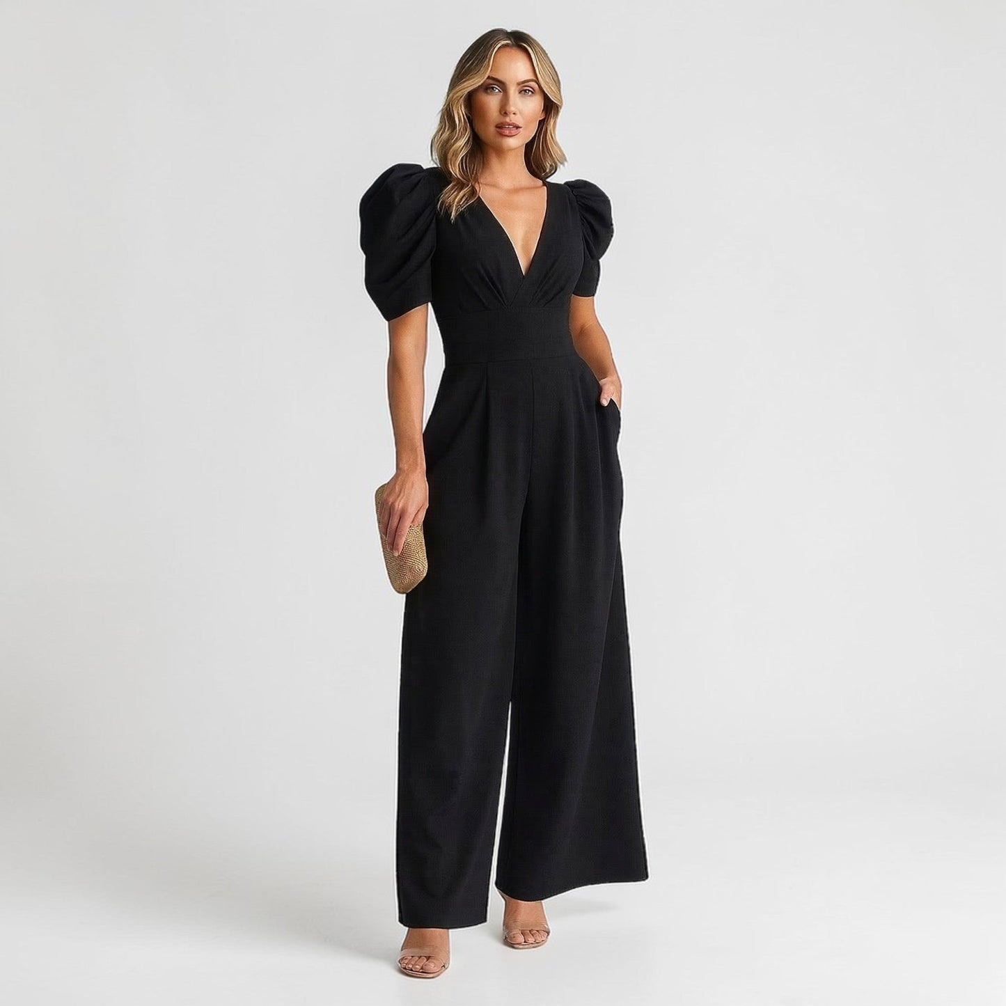 Black wide leg jumpsuit with puff sleeves, deep V-neck, and tailored waist