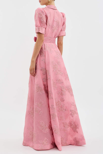 Back view of pink floral maxi dress with puff sleeves and full flowing skirt