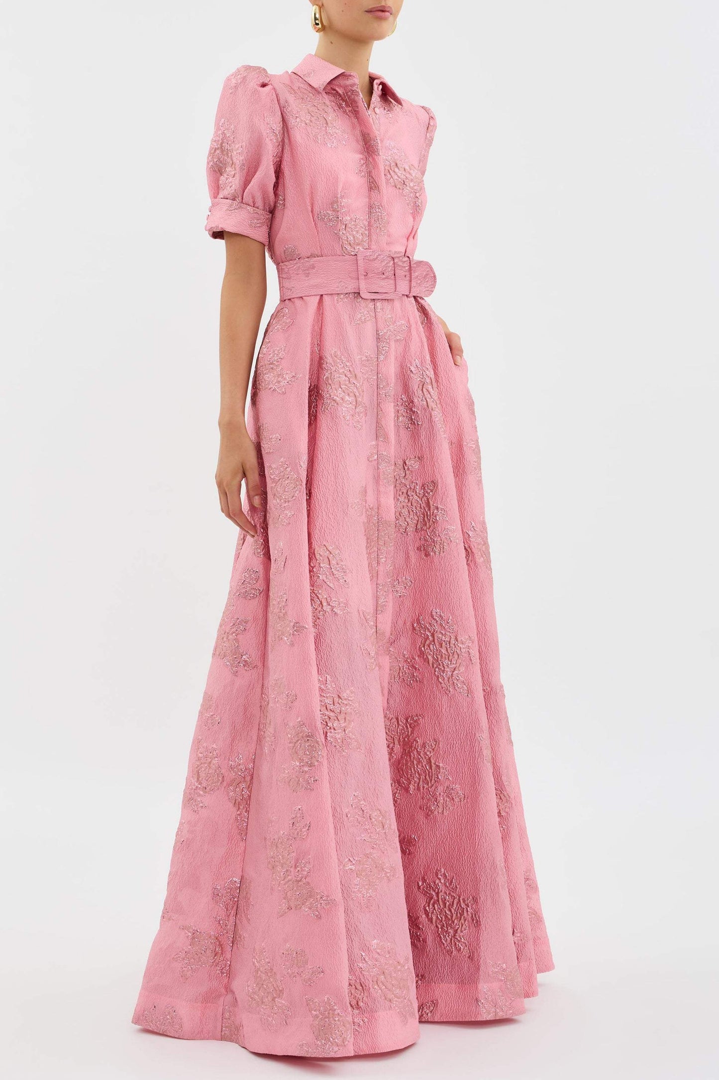 Side view of pink floral maxi dress showing belted waist and long A-line skirt
