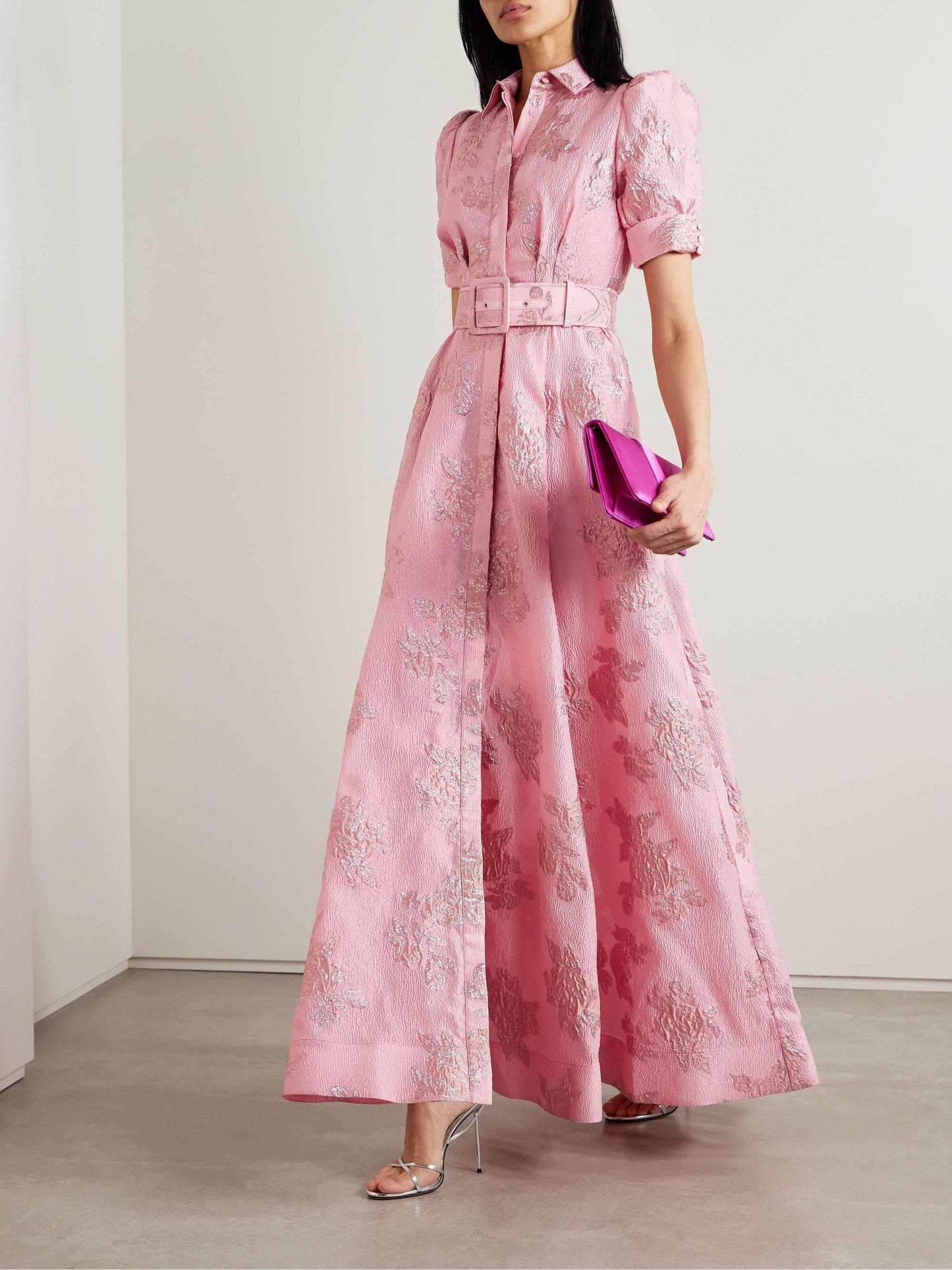 Pink floral maxi dress with puff sleeves, collared neckline, and wide belted waist