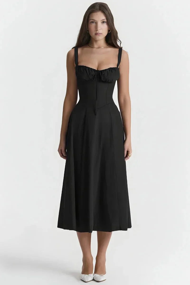Black midi dress with ruched bust, fitted waist, and sleeveless straps