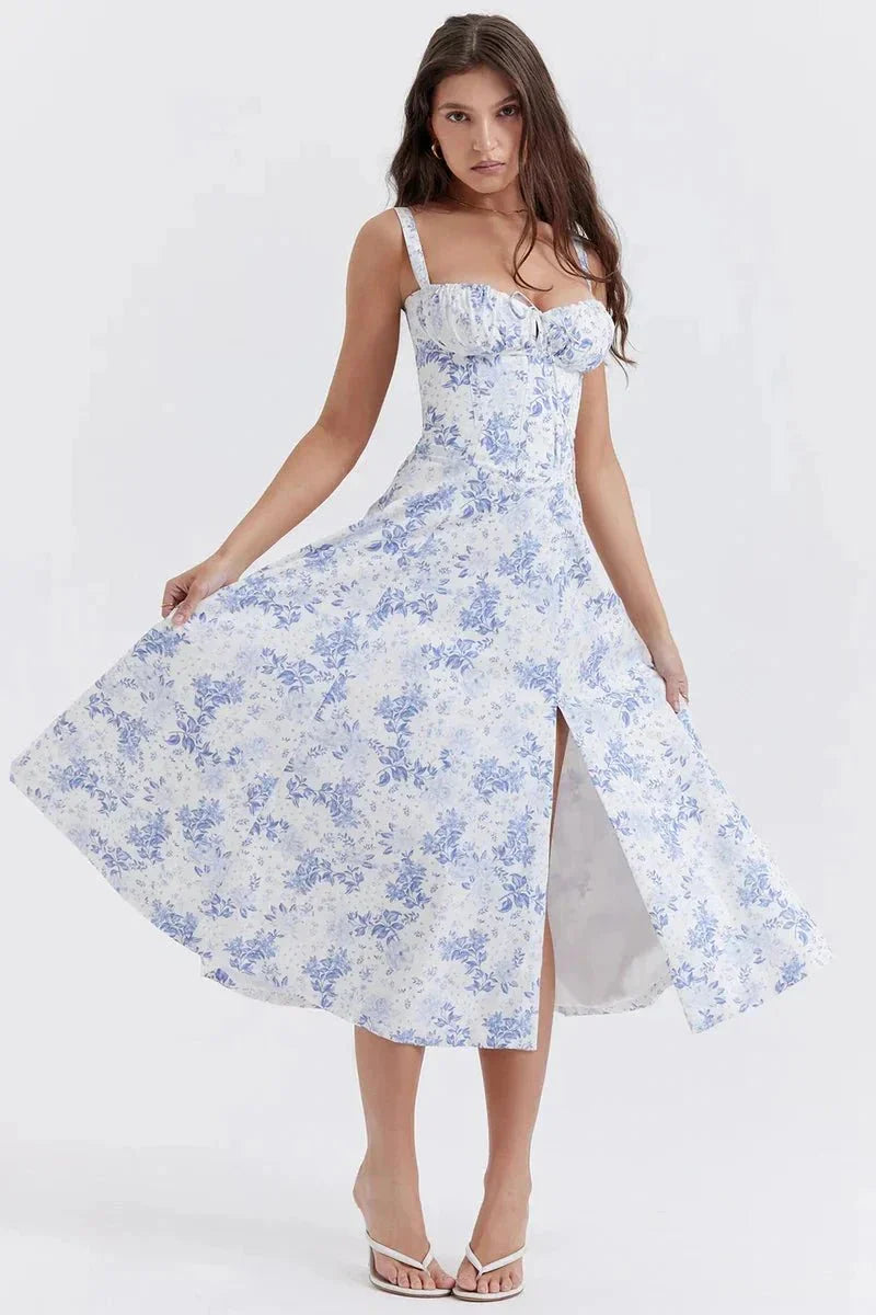 Blue and white floral midi dress with square neckline, wide straps, and side slit