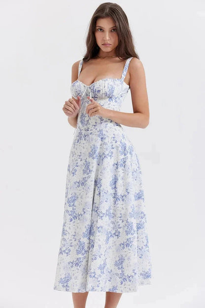 Front view of blue floral midi dress with fitted bodice, wide straps, and flared skirt