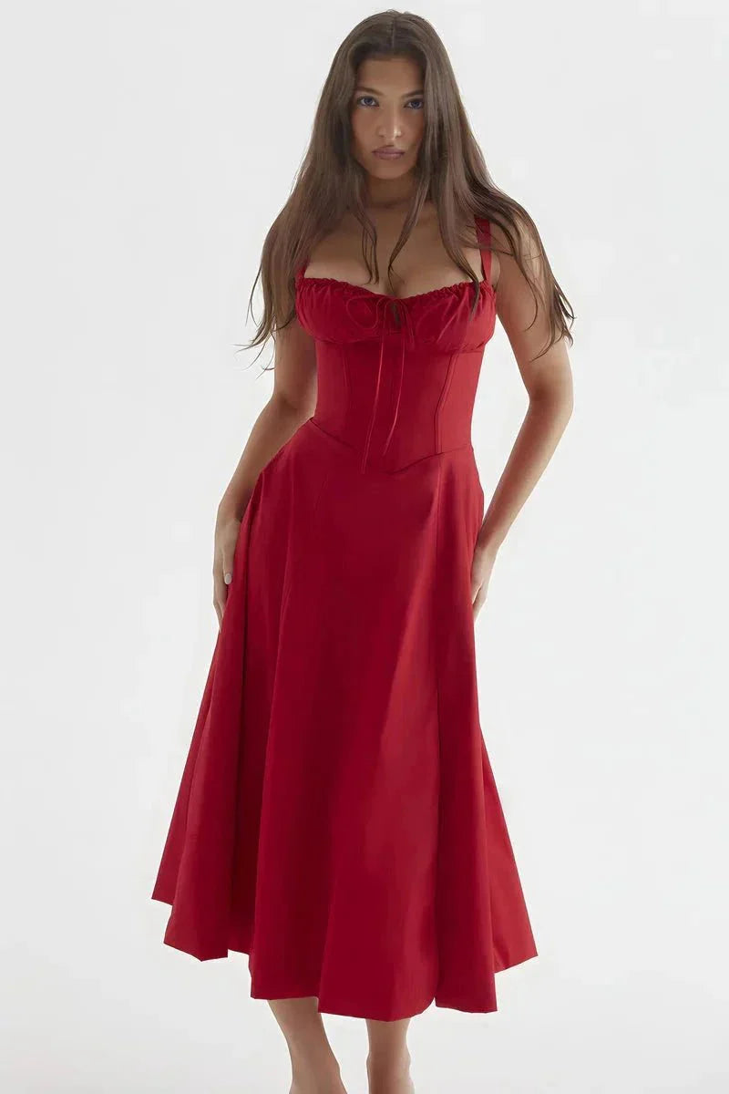 Red midi dress with ruched bust, corset-style waist, and flowing skirt