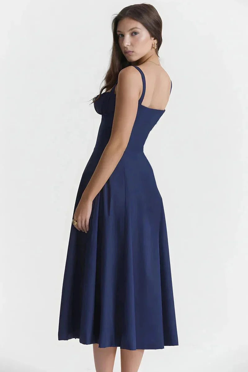 Back view of navy blue midi dress with open back and straps