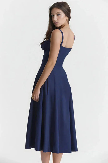 Back view of navy blue midi dress with open back and straps