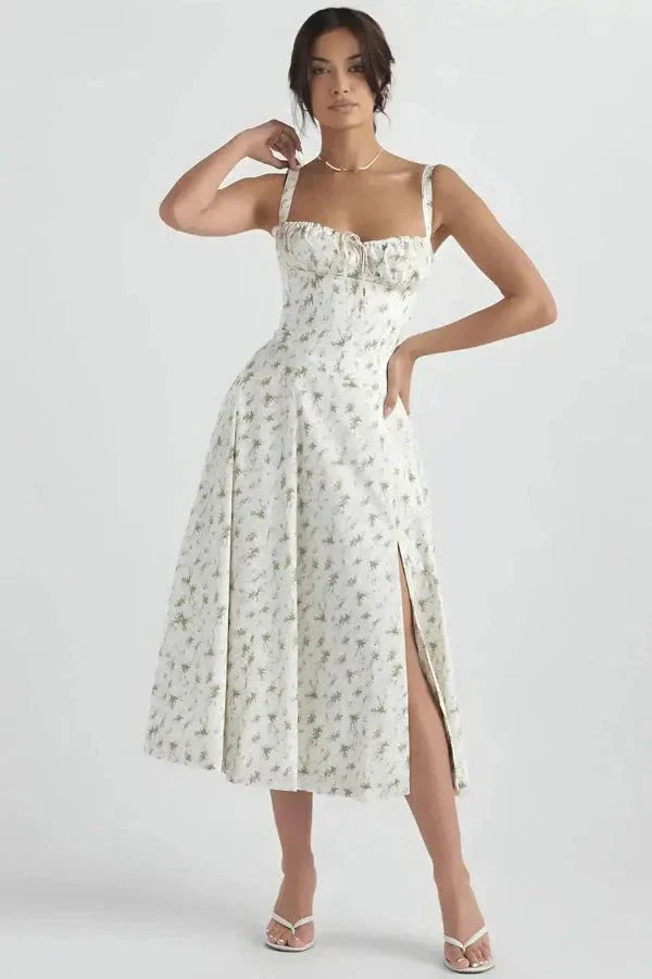 White floral midi dress with square neckline, wide straps, and front slit