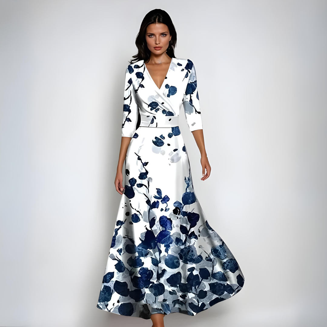 White floral maxi dress with V neck, three quarter sleeves, and navy blossom print