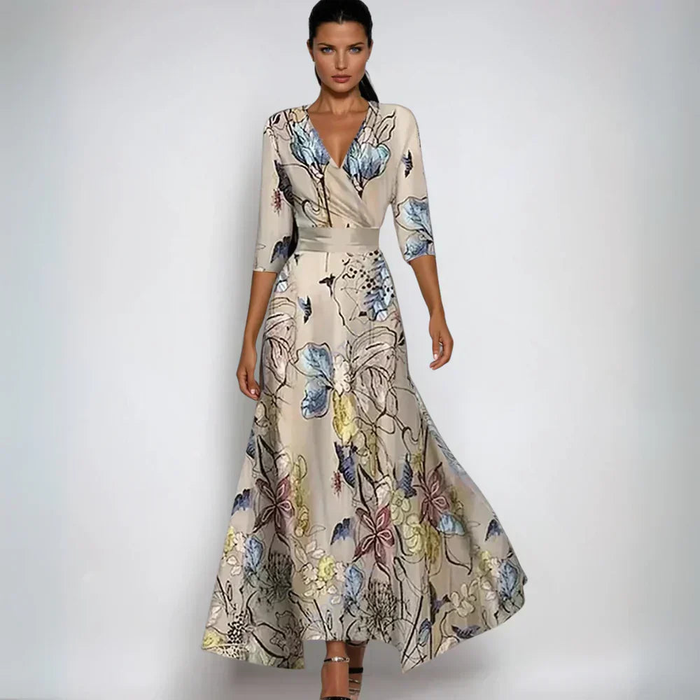 Beige floral maxi dress with V neck, three quarter sleeves, and flowing skirt