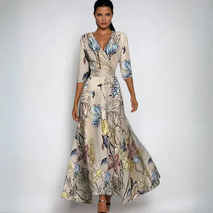 Beige floral maxi dress with V neck, three quarter sleeves, and flowing skirt