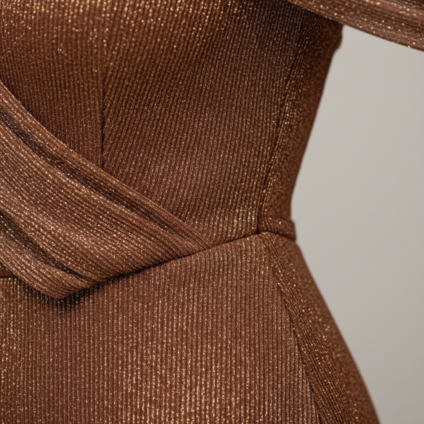 Back view of brown formal maxi dress with one shoulder drape and sleek fitted skirt
