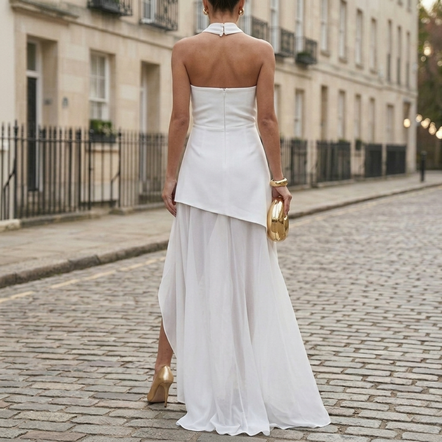 Back view of white formal maxi dress with strapless neckline and slit