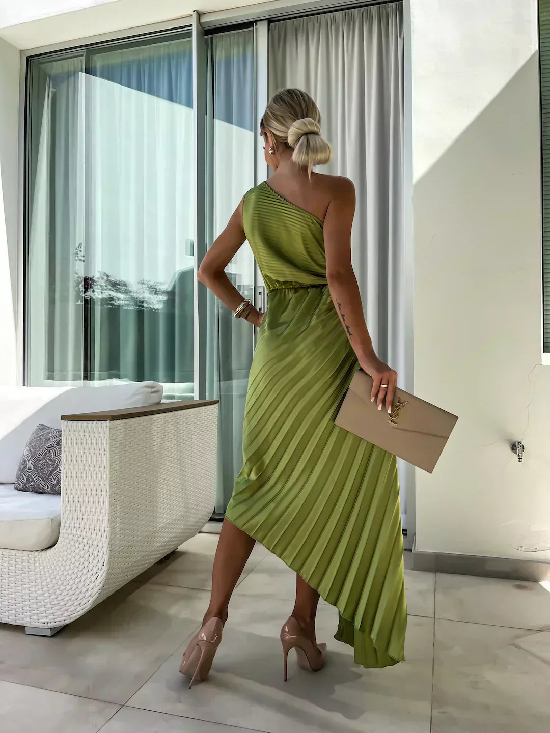 Back view of olive green one shoulder pleated midi dress with asymmetrical hem