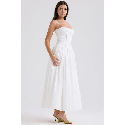 Side view of white summer dress with fitted bodice and soft pleated maxi skirt