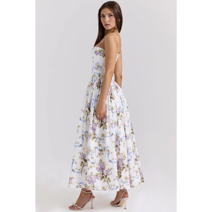 Side view of a women's floral maxi dress showing a fitted waist and flowing summer dress skirt