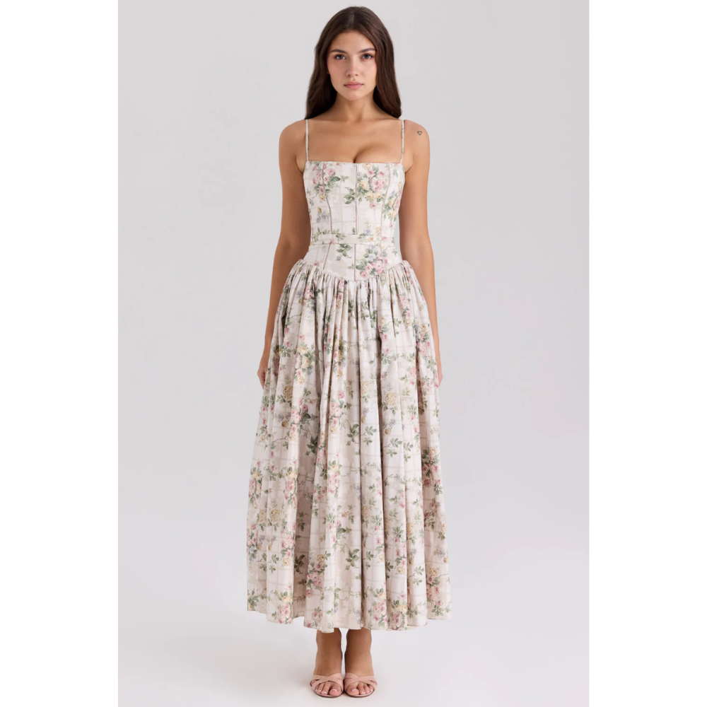 Front view of floral maxi dress with thin straps, corset-style bodice, and gathered skirt