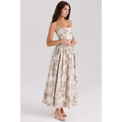 Floral maxi dress with square neckline, straps, and softly pleated skirt