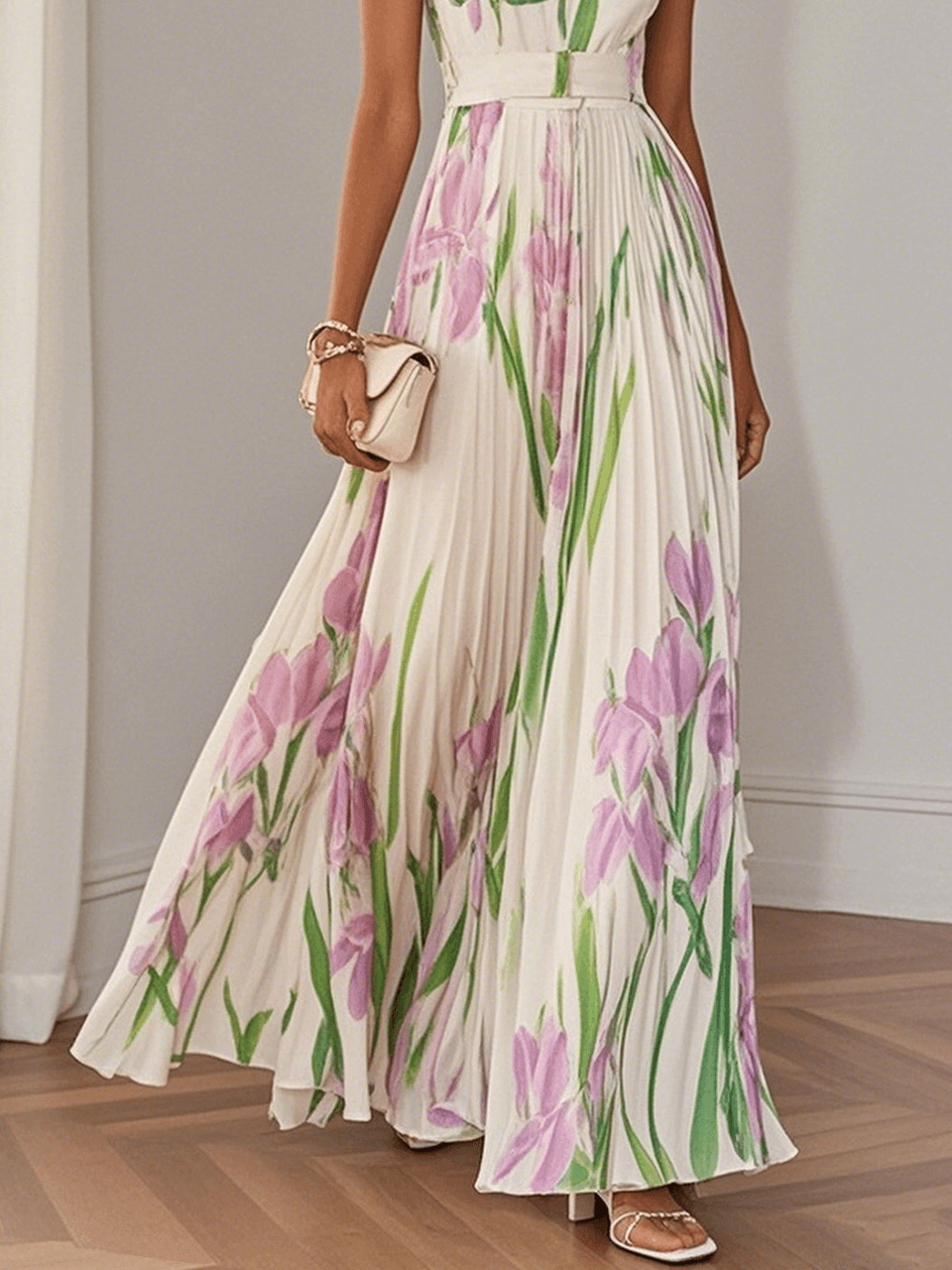 Midsection view of women's summer floral maxi dress with pleated skirt and pink green botanical print