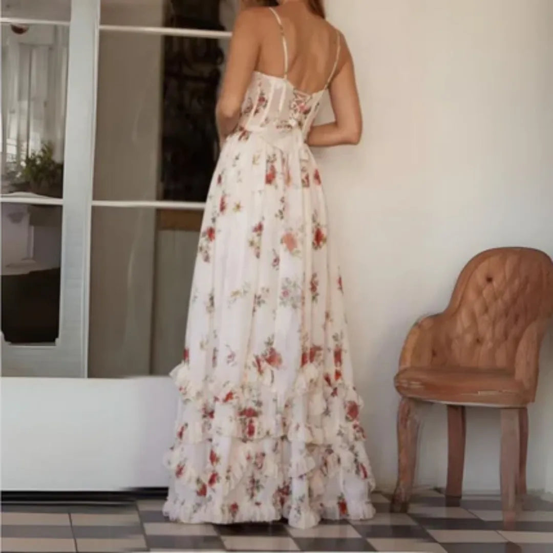 Back view of cream floral spaghetti strap maxi dress with fitted waist