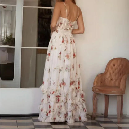 Back view of cream floral spaghetti strap maxi dress with fitted waist