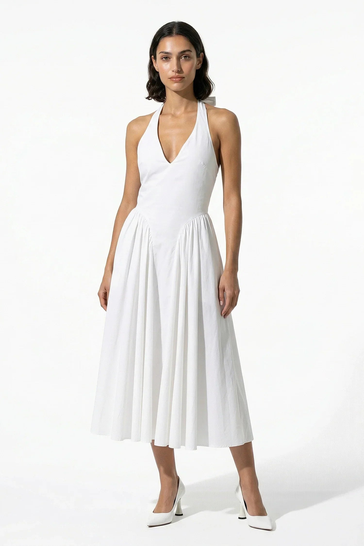 Black halter midi dress from the back with zipper closure and gathered skirt