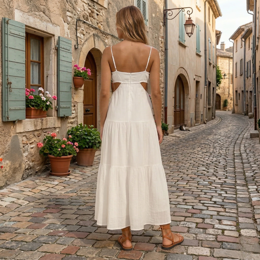 Back view of white summer maxi dress with thin straps and cutout waist detail