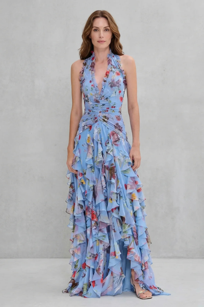 Front view of blue floral halter maxi dress with ruched waist and slit skirt