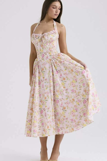 Studio front view of floral halter midi dress with corset-style waist and midi length