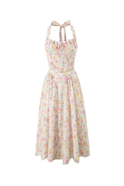 Hanging pink floral halter midi dress with ruched top and full skirt on white background
