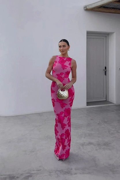 Full-length pink floral maxi dress with sleeveless cut and wedding guest style