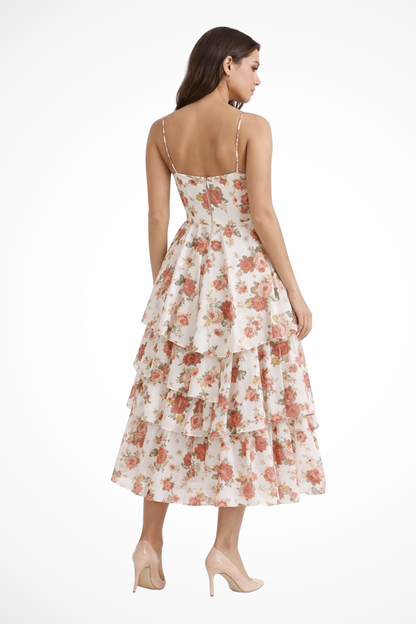 Back view of floral midi dress with fitted bodice and layered ruffle skirt