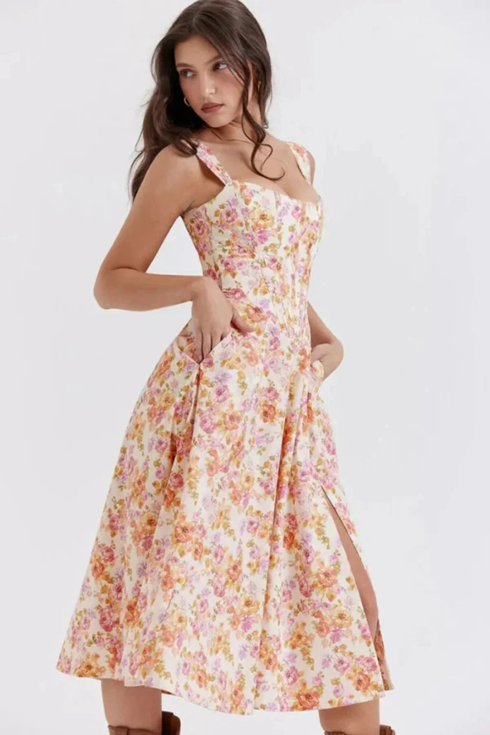 Side view of floral midi dress with fitted bodice and slit skirt, a stylish wedding guest dress