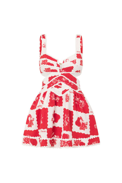 Back view of a floral mini dress showing crisscross straps and a fitted waistline