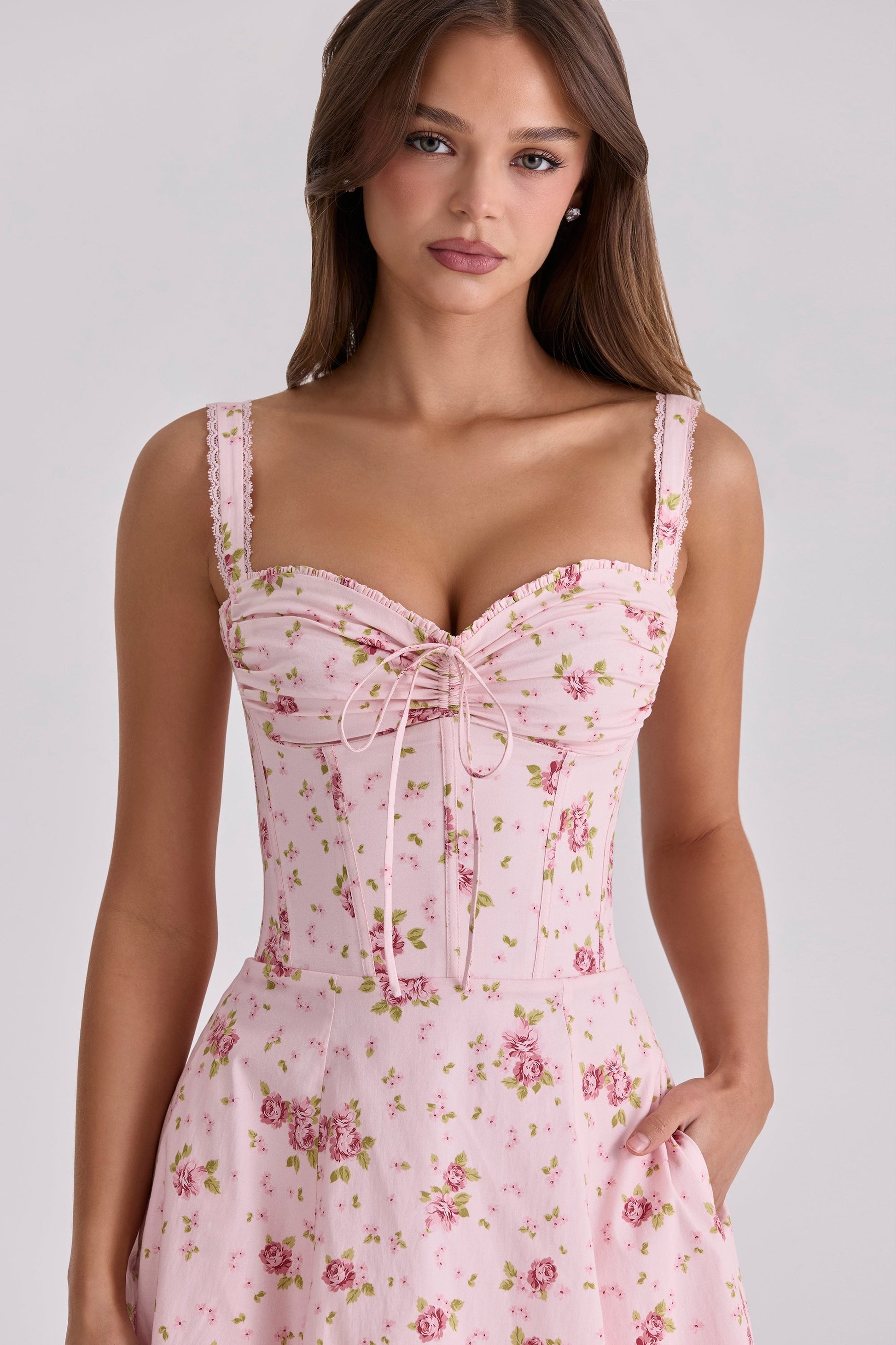 Pink floral sweetheart midi dress with ruched bust, lace straps, and corset-style bodice