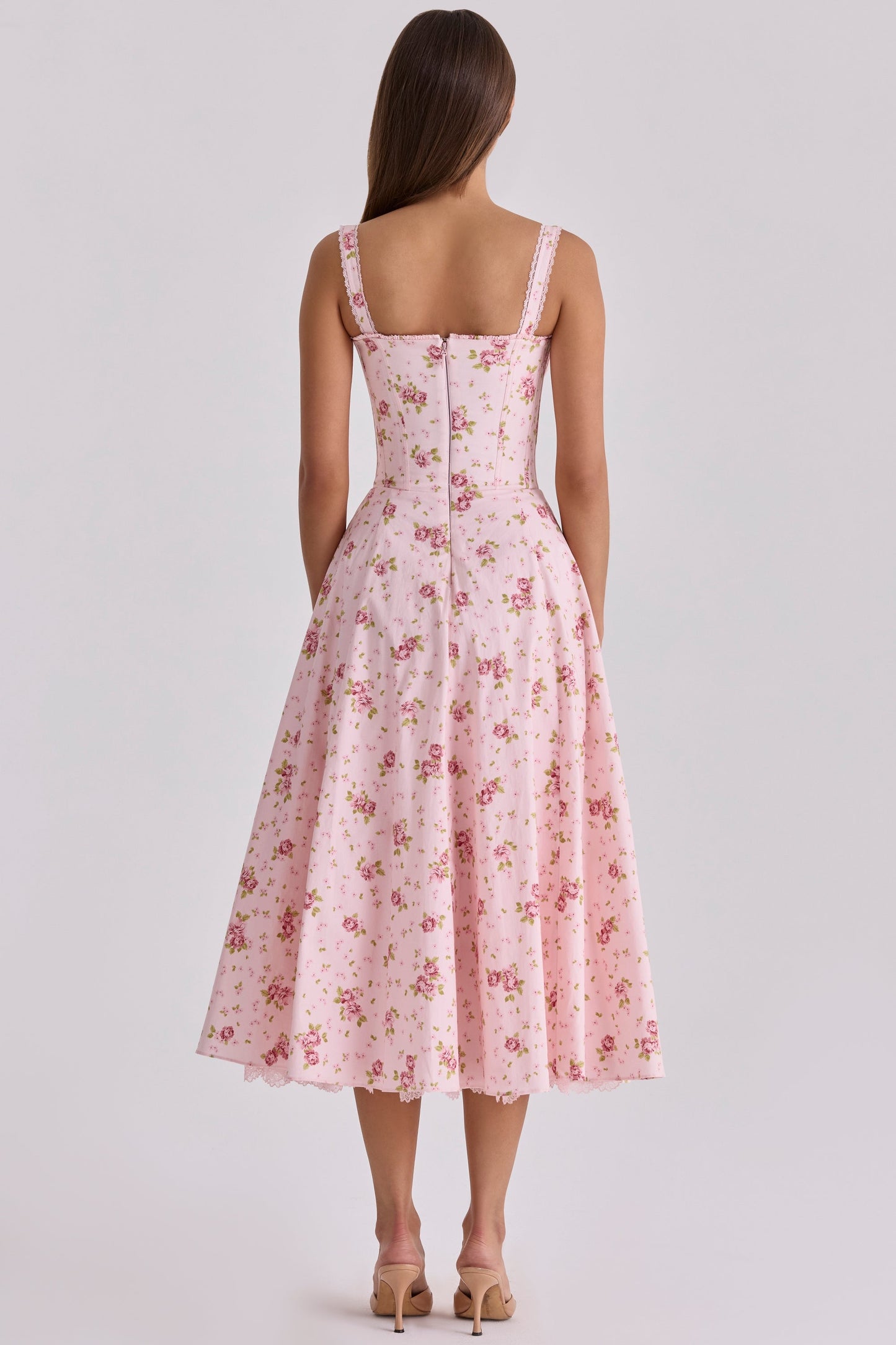 Back view of pink floral wedding guest midi dress with lace straps and full skirt