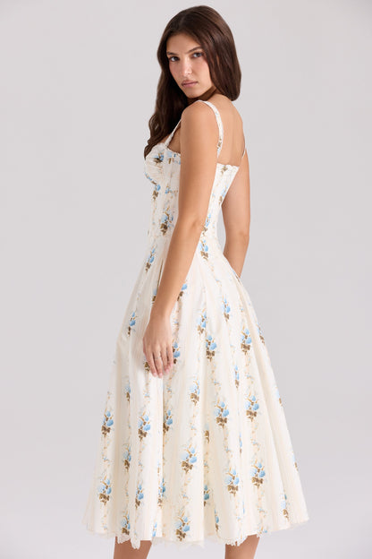 Front view of cream floral midi dress with sweetheart neckline, tie detail, and pockets