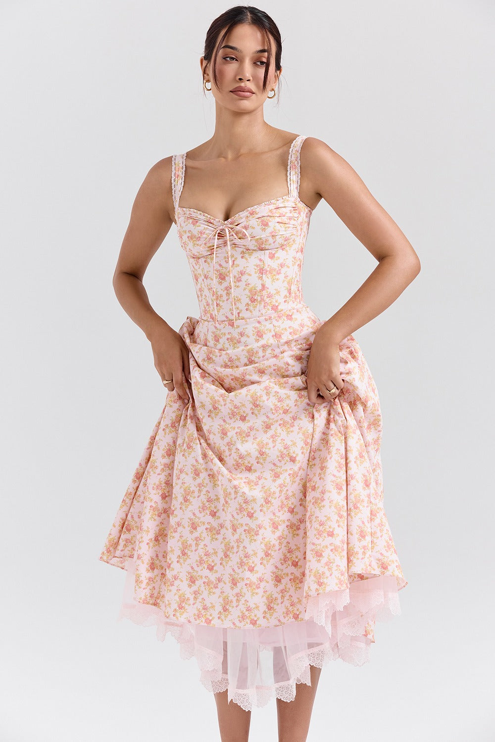 Front view of floral sweetheart midi dress with lace straps, ruched bust, and A-line skirt