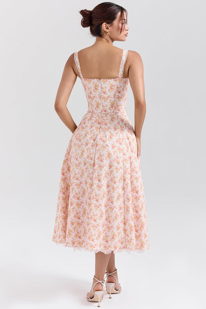 Floral midi dress shown with gathered skirt lifted to reveal lace trim and layered hem detail