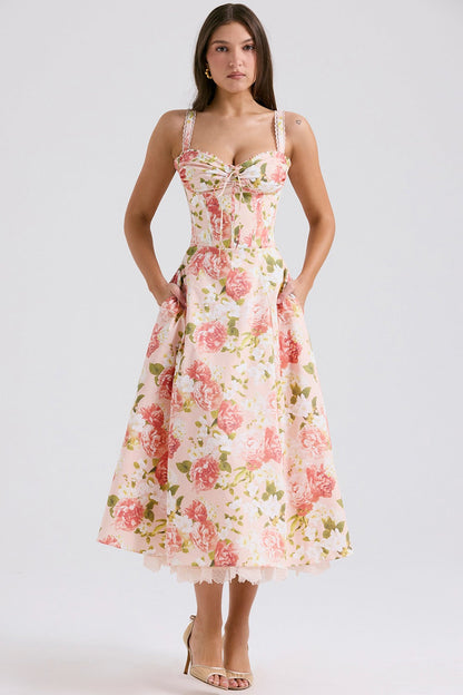 Back view of floral midi dress with fitted bodice, flared skirt, and lace hem peeking out