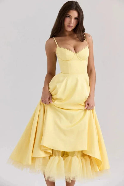Yellow midi dress with sweetheart bust, fitted waist, and layered tulle hem for wedding guest wear
