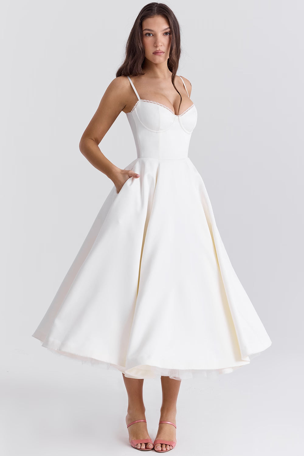 White midi wedding guest dress with spaghetti straps, fitted bodice, and full skirt
