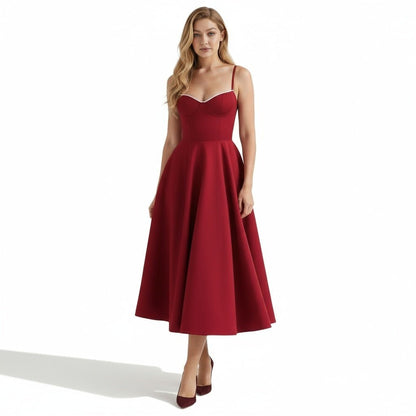 Front view of a burgundy midi dress with thin straps and a fitted corset-style bodice