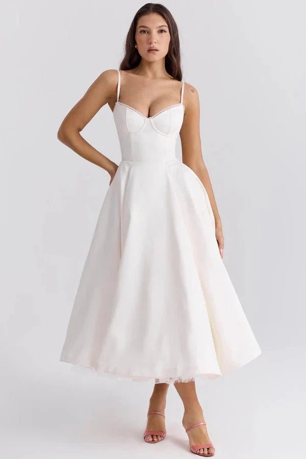 White midi dress with fitted bodice and full skirt for wedding guest