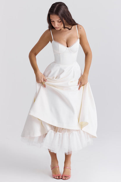 White midi dress with gathered skirt and tulle hem for wedding guest
