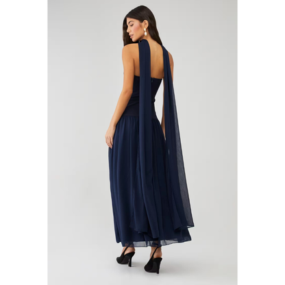 Back view of navy strapless maxi dress with open back and long sheer scarf detail