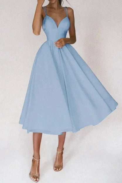 Front view of light blue wedding guest midi dress with V neck and full skirt
