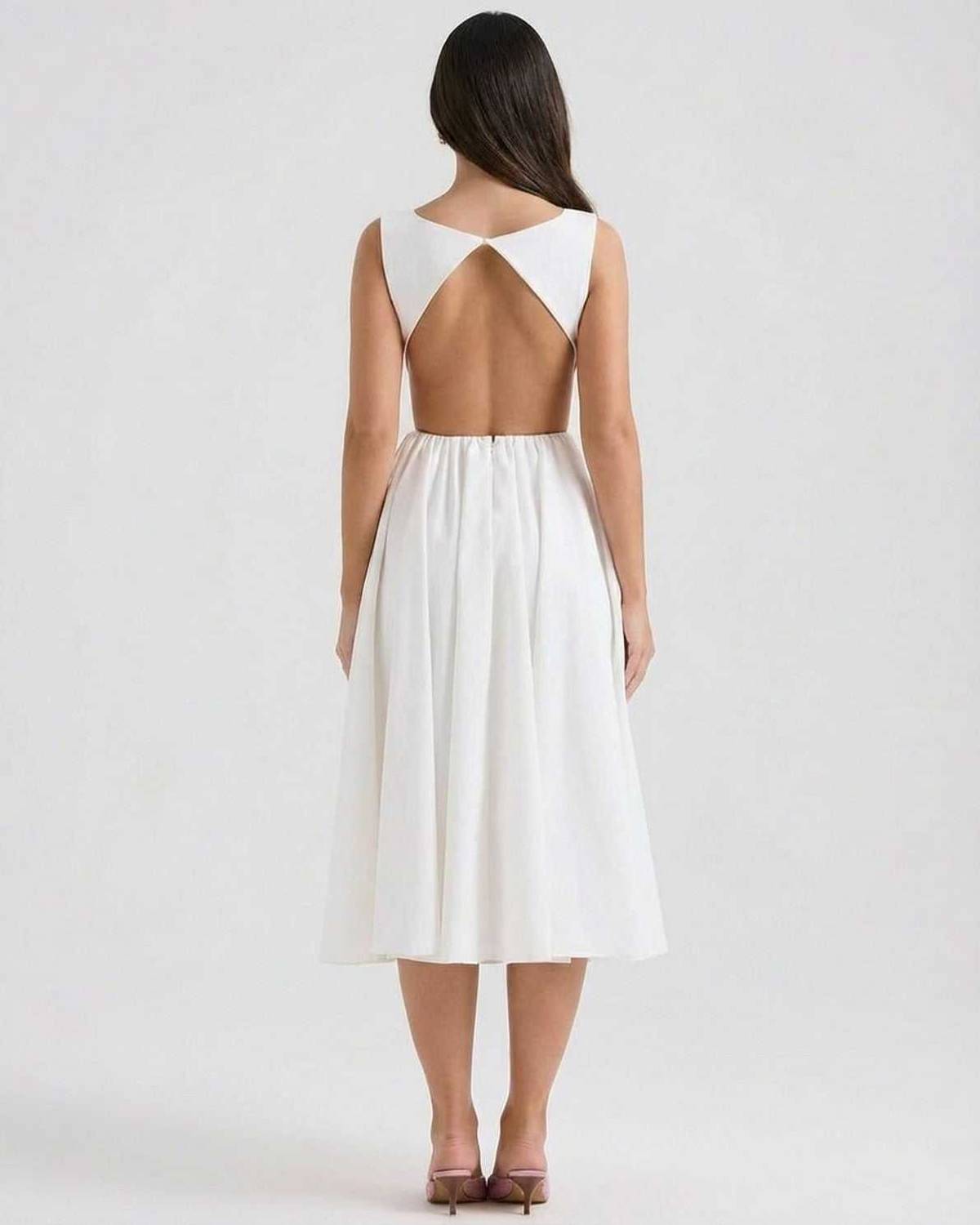 Back view of white midi dress with open back cutout and sleeveless bodice