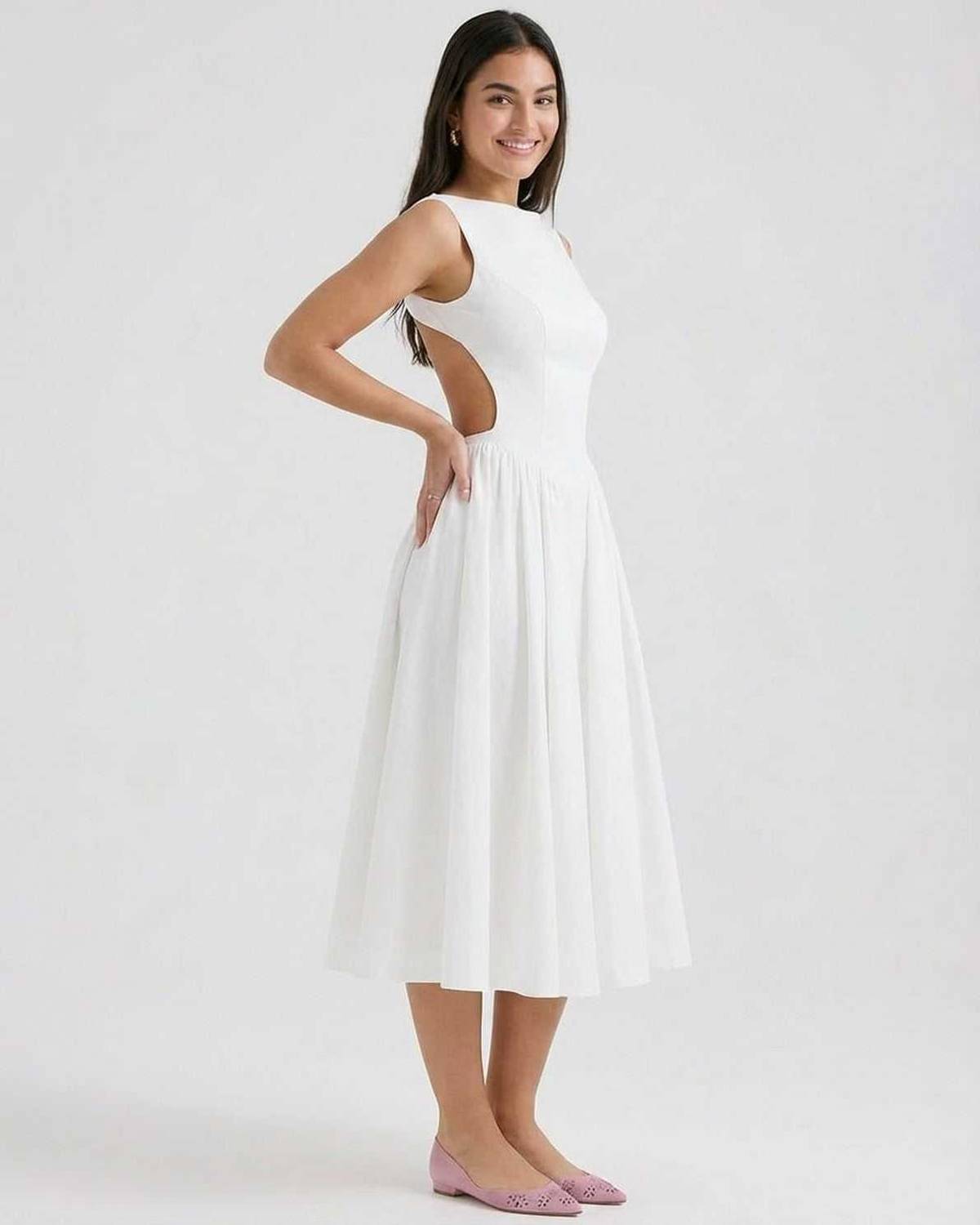 White sleeveless midi dress with side cutout detail and fitted waist, angled view